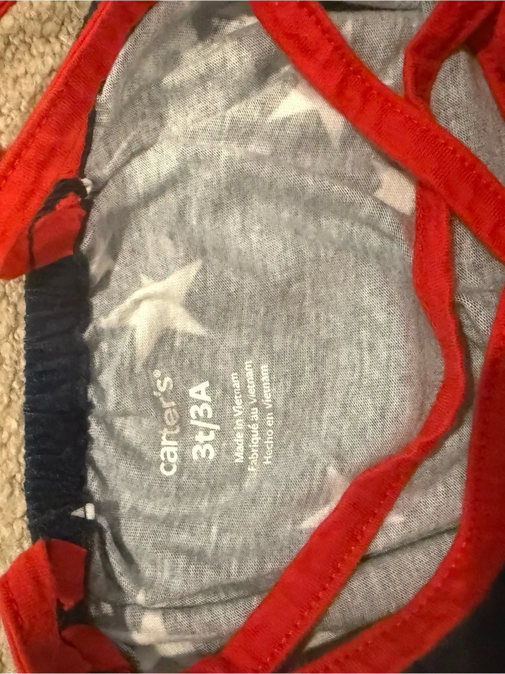 2 toddler tanks: plaid Oshkosh, star Carters